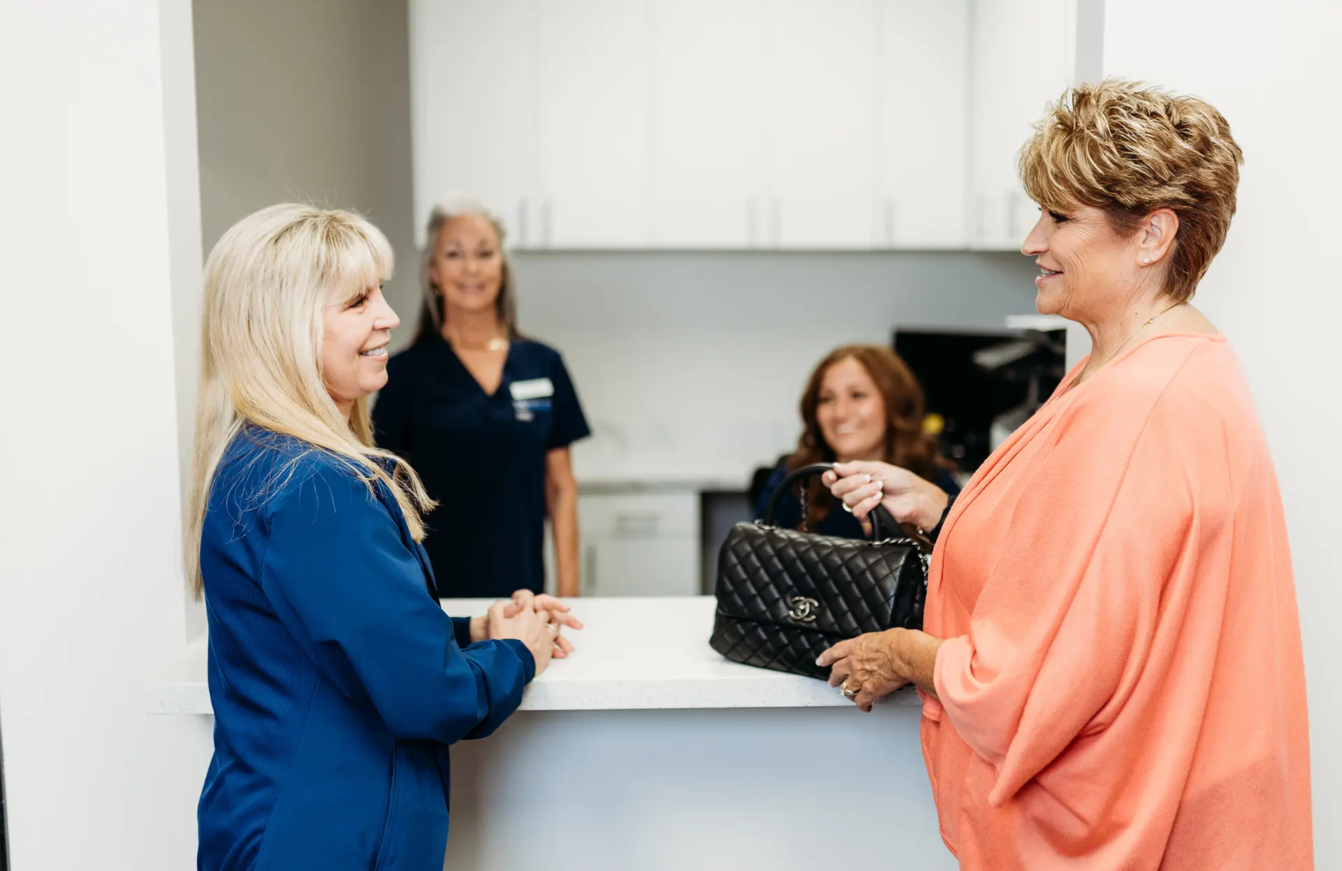 Dr. Jaclyn A. Klimczak inspect female patient before treatment