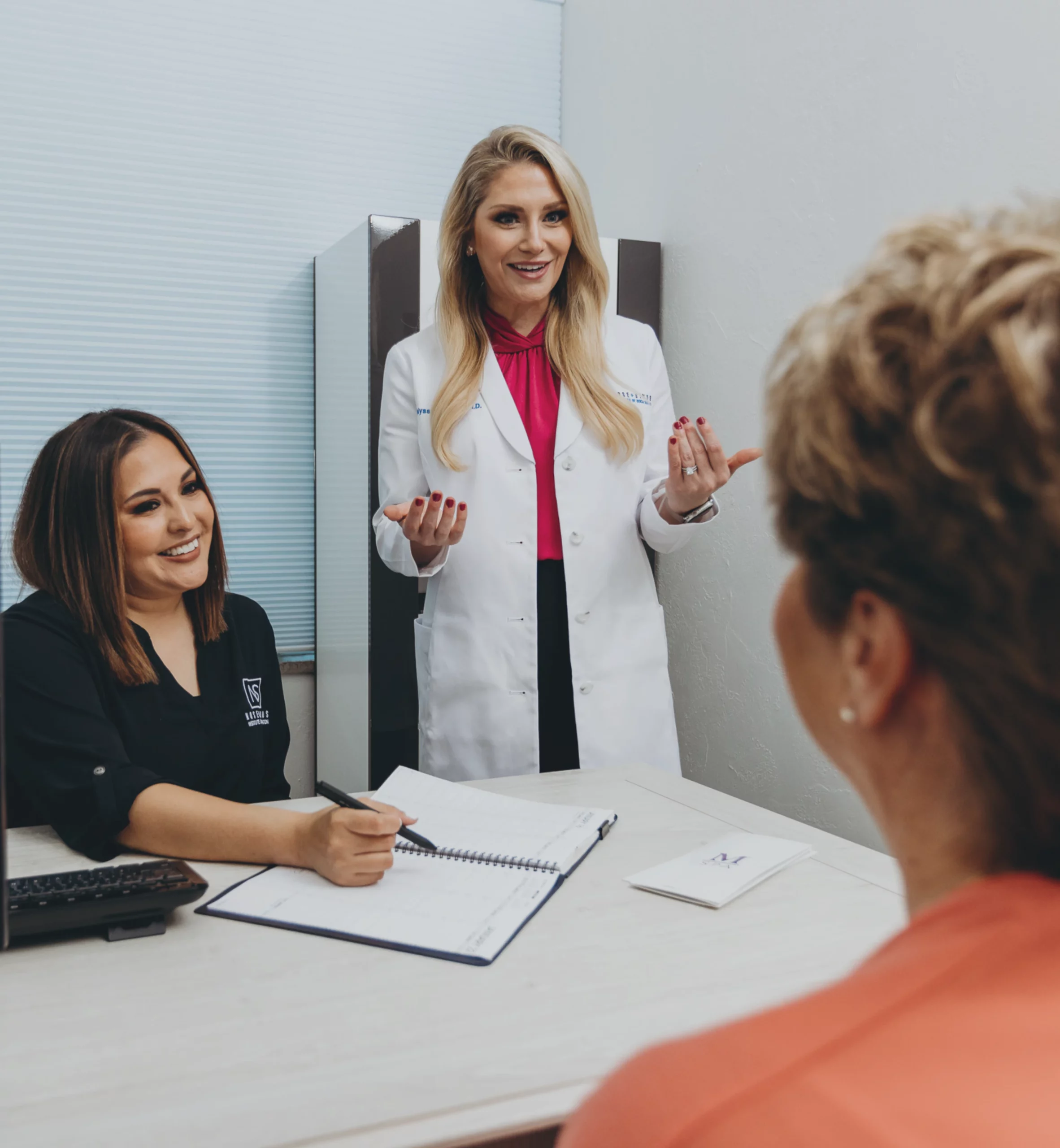 Two Female Board-Certified Facial Plastic Surgeons Standing In Their Office