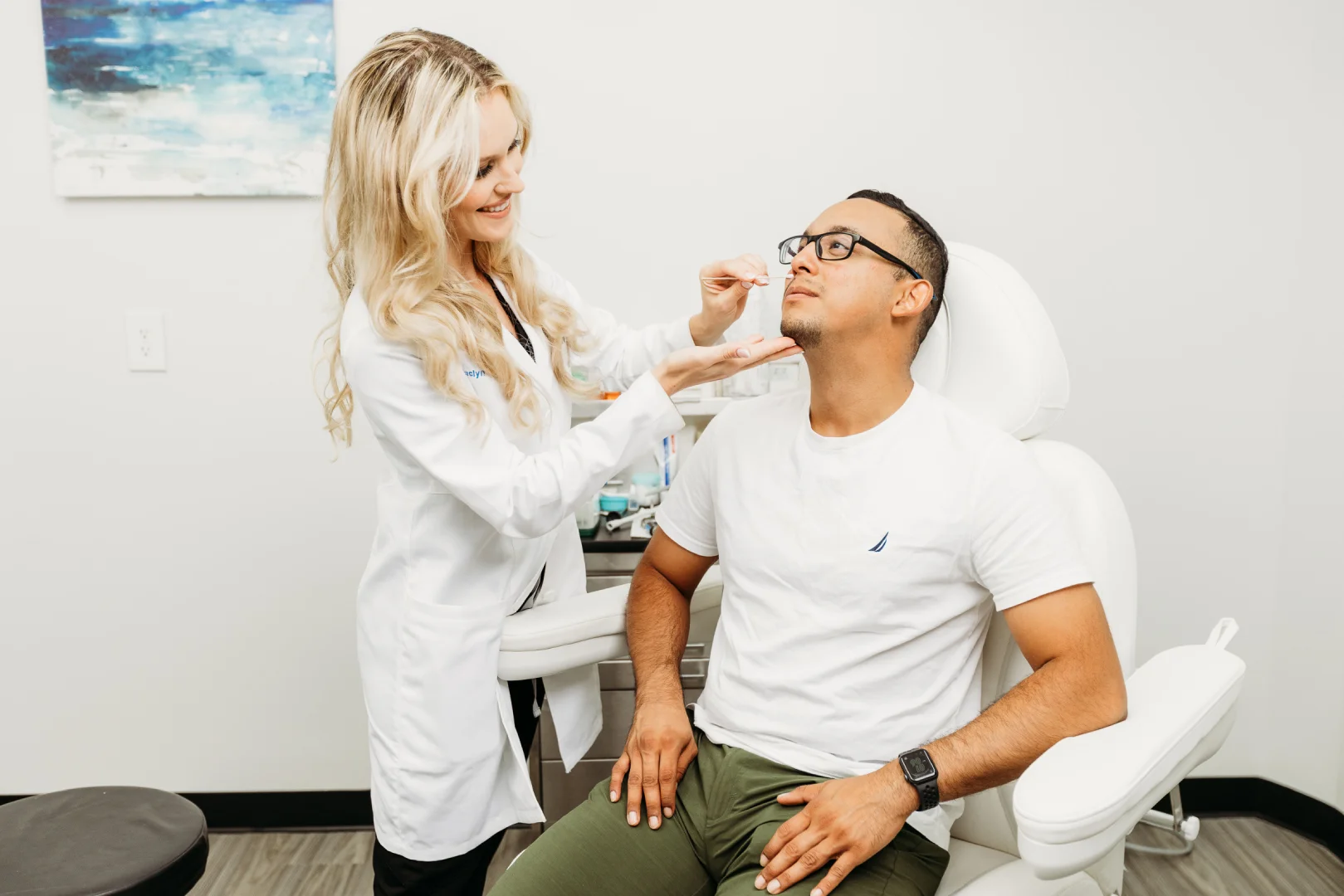 Dr Hancock Examining Patient During Nose Injury Recovery