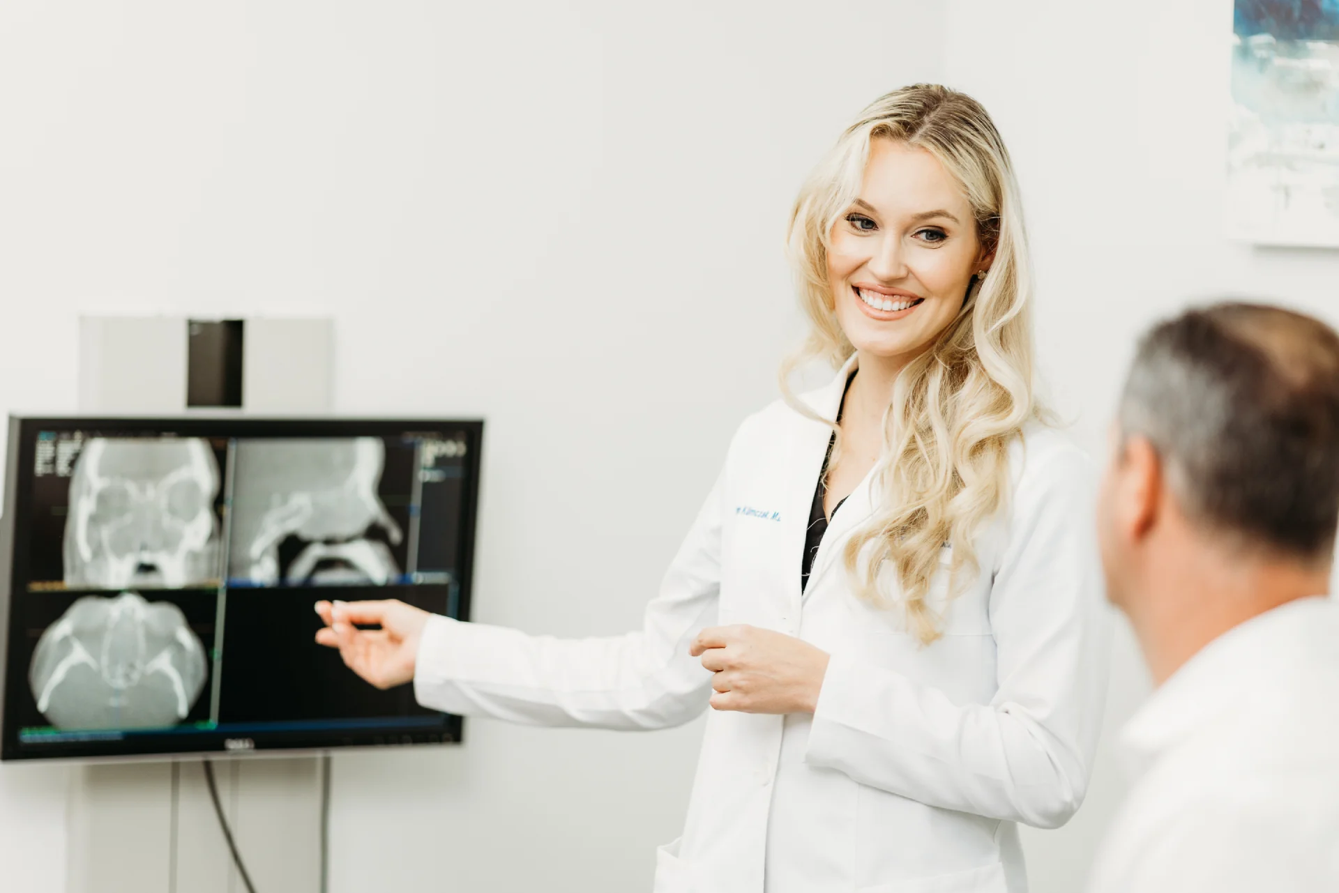 Dr Hancock Explaining Facial Volume Loss to a Patient