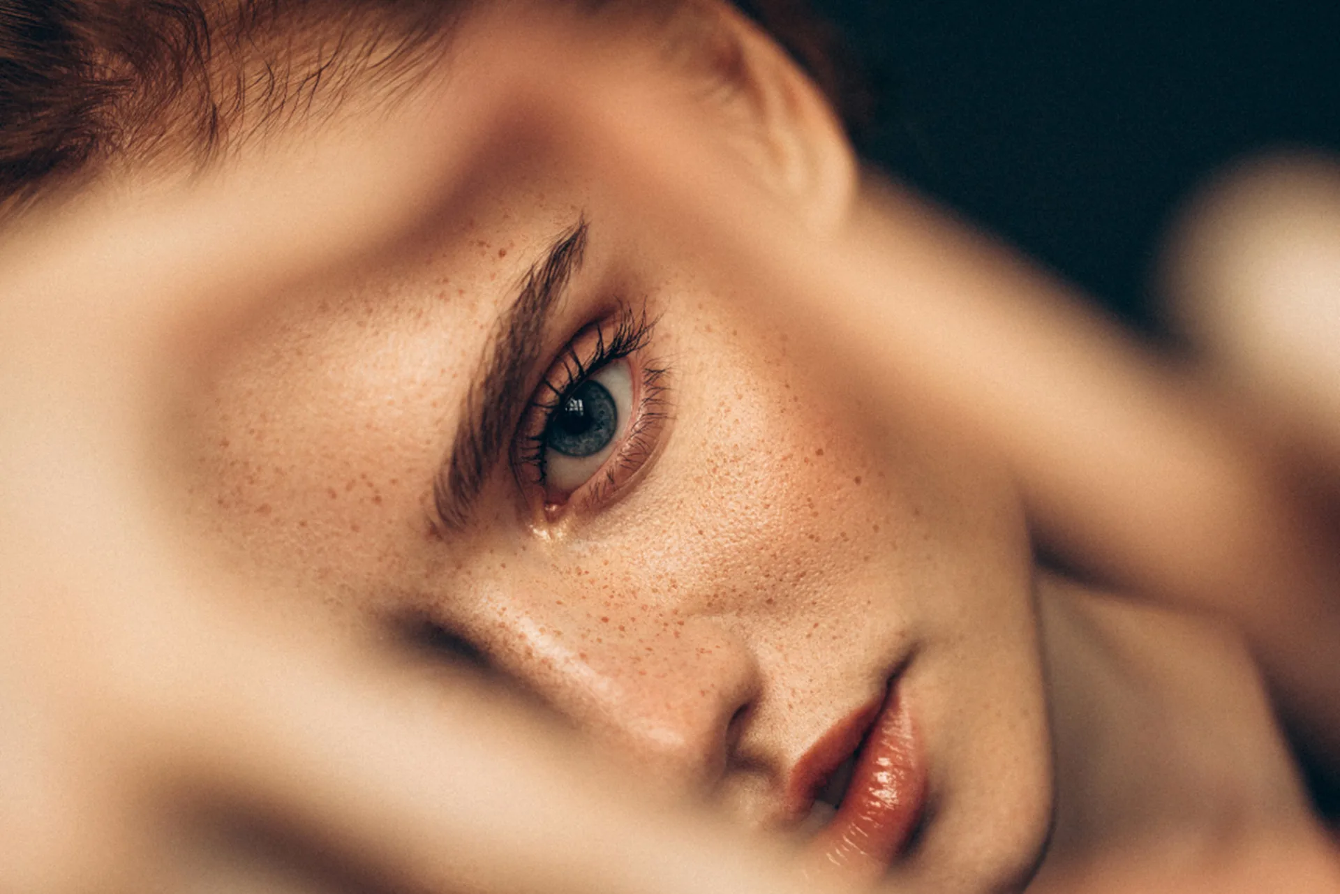 Drooping eyebrows: Close-up of young woman’s eye and brow highlighting sagging position