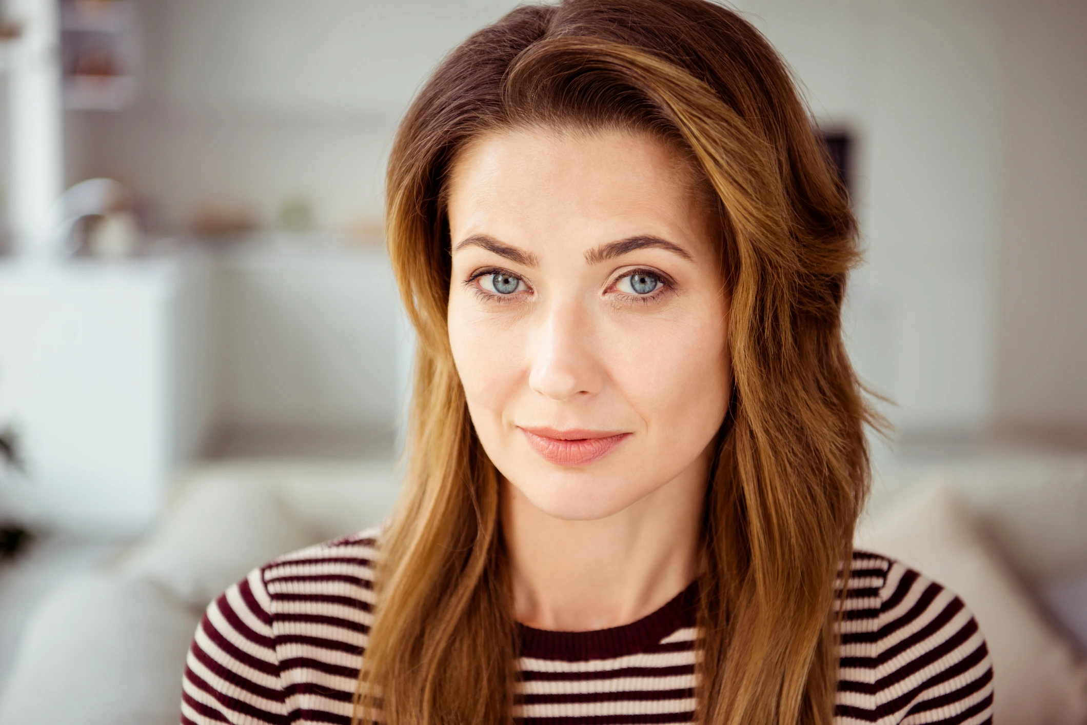Drooping eyebrows: Surgeon consulting older female patient evaluating brow position